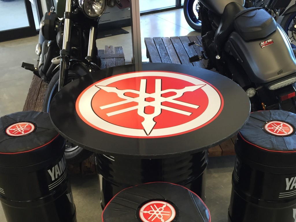Vinyl wrap table top with tuning fork logo.
